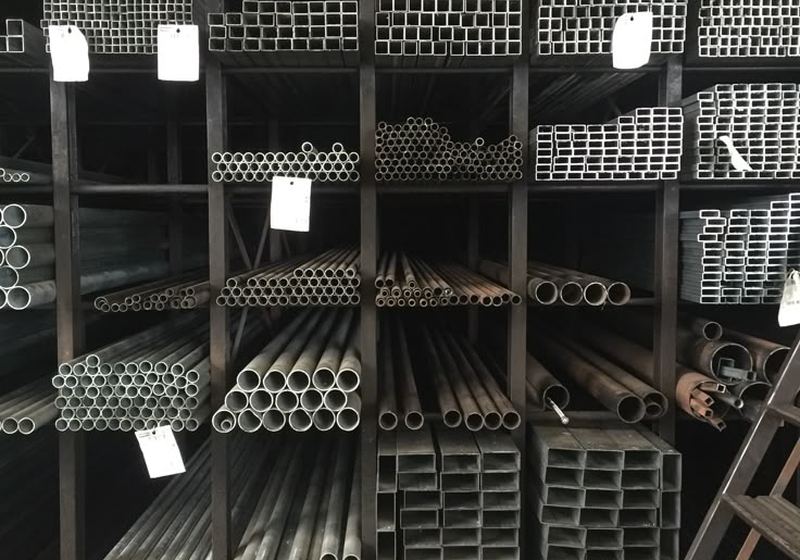 Steel tubes and sections stored on racks